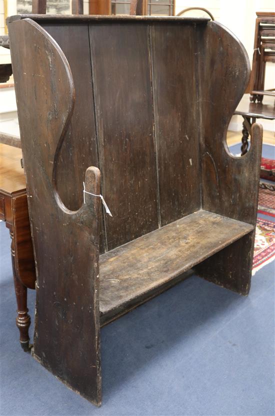 An 18th century elm and deal settle W.104cm